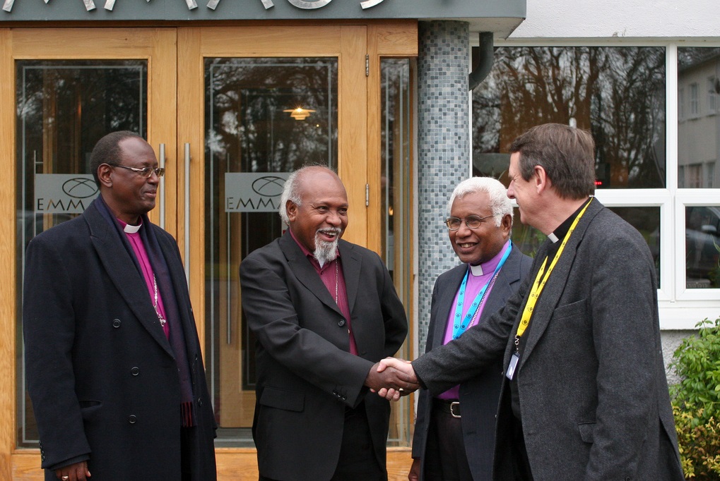 (L to R) Burundi Archbishop Bernard Ntahoturi, Papua New Guinea Archbishop Archbishop Joseph Kopapa, Melanesia's Archbishop David Vunagi is greeted by Secretary General of the Anglican Communion Kenneth Kearon